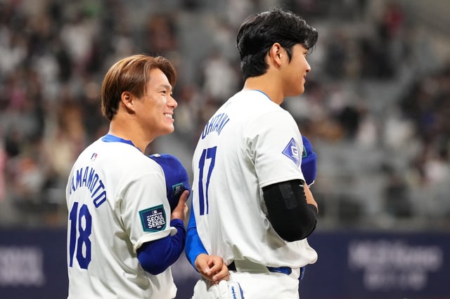 Yoshinobu Yamamoto #18 and Shohei Ohtani #17 of the Los Angeles Dodgers are seen prior to the exhibition game between Los Angeles Dodgers and Kiwoom Heroes at Gocheok Sky Dome on March 17, 2024 in Seoul, South Korea.