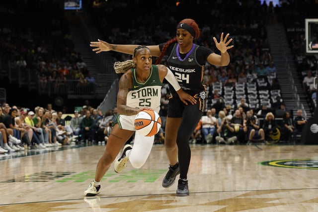 Tiffany Mitchell #25 of the Seattle Storm dribbles the ball past Aneesah Morrow #24 of the Connecticut Sun during the game at Climate Pledge Arena on July 11, 2025 in Seattle, Washington. The Seattle Storm won 79-65.