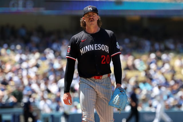 Jul 23, 2025; Los Angeles, California, USA;  Minnesota Twins starting pitcher Chris Paddack (20) walks back to the dugout after pitching sixth inning against the Los Angeles Dodgers at Dodger Stadium. Mandatory Credit: Kiyoshi Mio-Imagn Images/File Photo