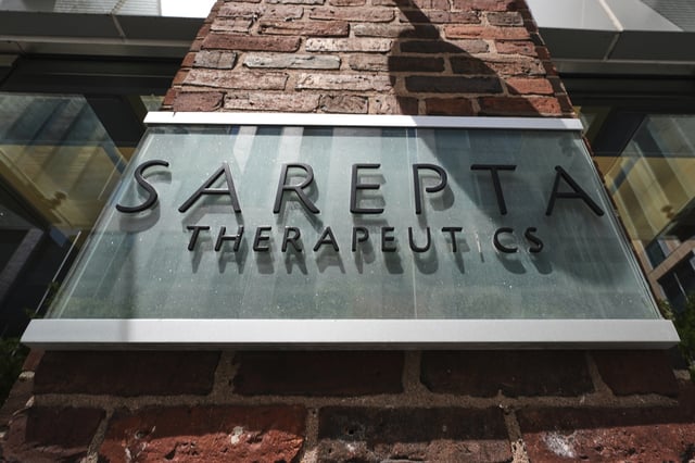 The name and logo of Sarepta Therapeutics is displayed on the company's headquarters, Monday, July 28, 2025, in Cambridge, Mass. (AP Photo/Charles Krupa)