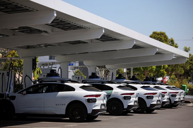 Waymo driverless vehicles charge at a Waymo charging station in Santa Monica, California, U.S., May 30, 2025. REUTERS/Daniel Cole/File Photo