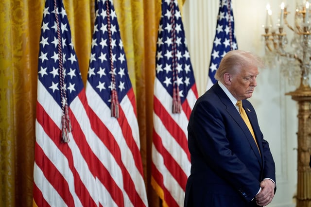 US President Donald Trump bows his head in prayer during a reception with Republican members of Congress in the East Room of the White House in Washington, DC, US, on Tuesday, July 22, 2025.