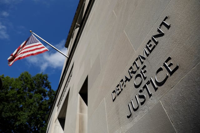 Signage is seen at the United States Department of Justice headquarters in Washington, D.C., U.S., August 29, 2020. REUTERS/Andrew Kelly/File Photo
