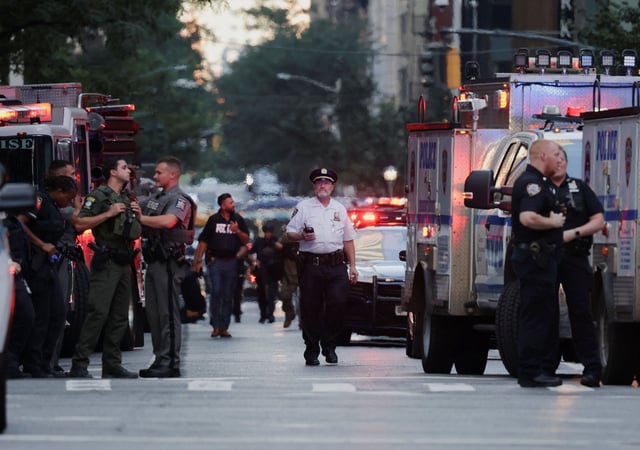 Police members gather during a reported active shooter situation in the Manhattan borough of New York City, U.S. July 28, 2025. REUTERS/Jeenah Moon
