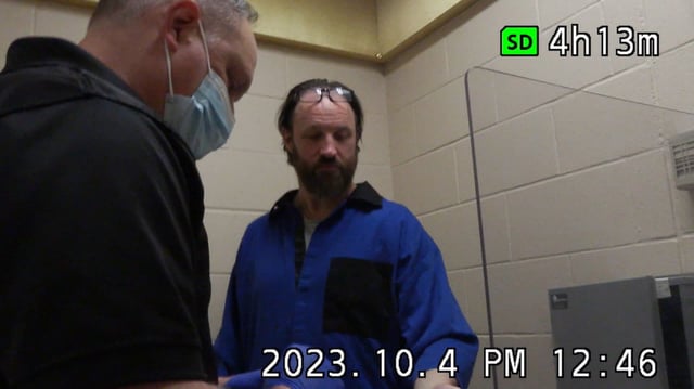 Video of Calgary police obtaining a DNA sample from 51-year-old Christopher Dunlop during questioning at the Calgary Remand Centre was played in court during his trial.
