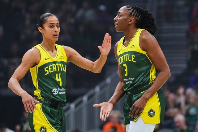 Seattle Storm guard Skylar Diggins (4) greets forward Nneka Ogwumike (3) during the first half of a WNBA basketball game against the Golden State Valkyries, Wednesday, July 16, 2025, in Seattle. (AP Photo/Lindsey Wasson)