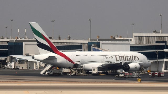 An Emirates Airlines Airbus A380 is parked at Cairo International Airport.
