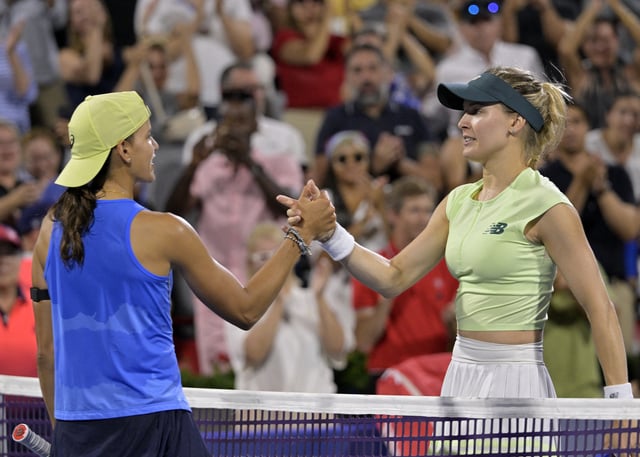Jul 28, 2025; Montreal, QC, Canada; Emiliana Arango (COL) and Eugenie Bouchard (CAN) shake hands after their match in first round play at IGA Stadium. Mandatory Credit: Eric Bolte-Imagn Images