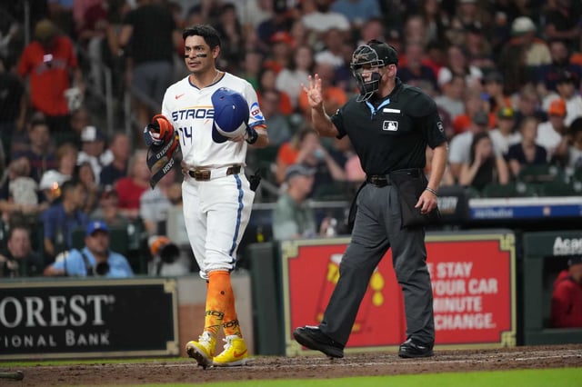Astros third baseman Mauricio Dubón (14) walks away after striking out with two men on to end the seventh inning in Monday&#39;s 2-1 loss to the Nationals.