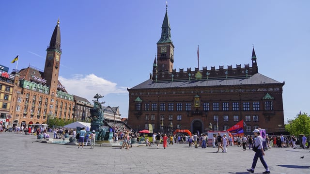 People gather in front of the Copenhagen City Hall in Copenhagen, Denmark. Friday 18 July 2025. (AP Photo/James Brooks)