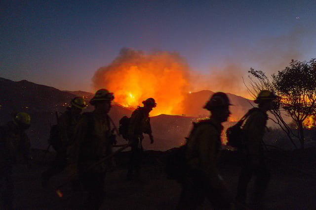 Firefighters in the growing Palisades fire on January 11. 