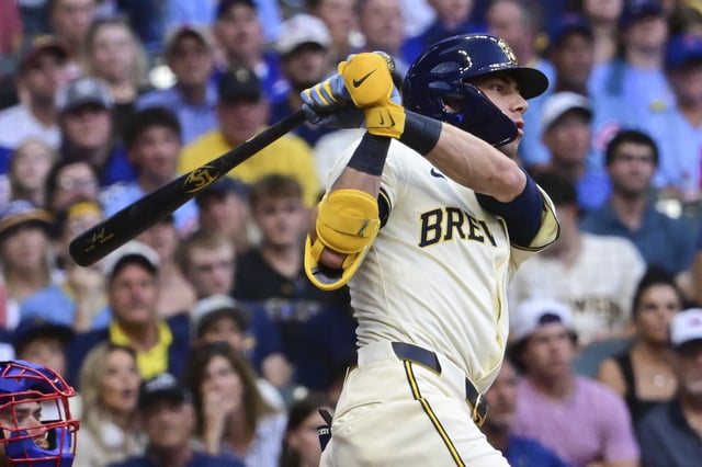 Jul 28, 2025; Milwaukee, Wisconsin, USA; Milwaukee Brewers designated hitter Christian Yelich (22) hits a double to drive in a run in the third inning against the Chicago Cubs at American Family Field. Mandatory Credit: Benny Sieu-Imagn Images