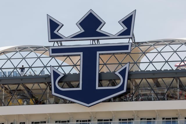 The logo of the company Royal Caribbean International is seen on the 'Wonder of the Seas' cruise ship, the world’s largest cruise ship, docked at a port in Malaga, southern Spain, April 30, 2022. REUTERS/Jon Nazca/File photo