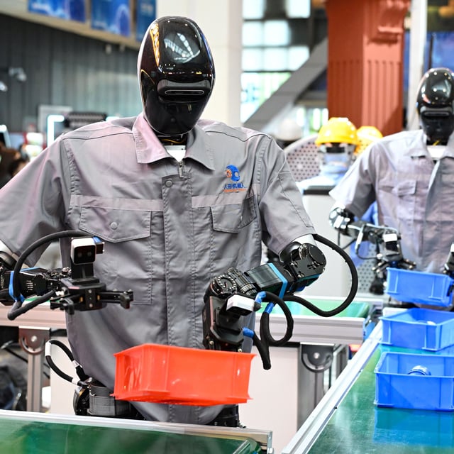 SHANGHAI, CHINA - JULY 26: Humanoid robots Qinglong sort goods at the logistics sorting line during the exhibition of 2025 World Artificial Intelligence Conference (WAIC2025) at the Shanghai World Expo Exhibition and Convention Center on July 26, 2025 in Shanghai, China. Under the theme "Global Solidarity in the AI Era," the annual three-day conference, running from Saturday to Monday, has attracted over 800 Chinese and international exhibitors, showcasing more than 3,000 exhibits - a record high, including 40 large language models, 50 AI-powered devices, and 60 intelligent robots, according to the organizer. (Photo by Tian Yuhao/China News Service/VCG via Getty Images)