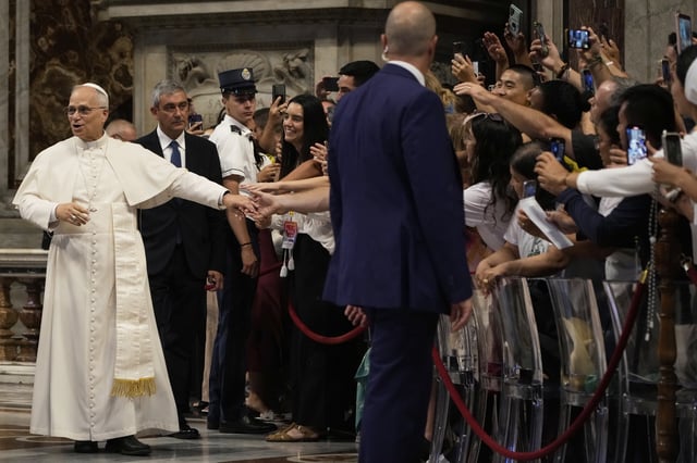 Pope Leo XIV greets faithful at the end of a mass celebrated by Cardinal Luis Antonio Tagle in St. Peter's Basilica on the occasion of the Youth Jubilee at the Vatican, Tuesday, July 29, 2025. (AP Photo/Gregorio Borgia)