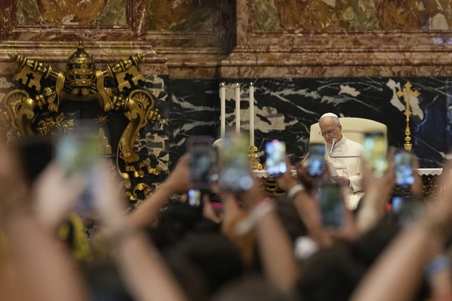 Pope Leo XIV greets faithful at the end of a mass celebrated by Cardinal Luis Antonio Tagle in St. Peter's Basilica on the occasion of the Youth Jubilee at the Vatican, Tuesday, July 29, 2025. (AP Photo/Gregorio Borgia)