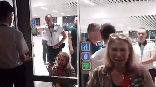 As other passengers watched from behind a glass door, the woman fell to her knees and wept as she continued pleading. 