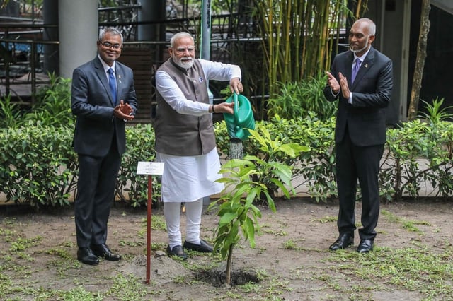 India’s Prime Minister Narendra Modi (centre) plants a tree sapling during his state visit in Male on July 25 as the Maldives’ President Mohamed Muizzu looks on. Photo: AFP