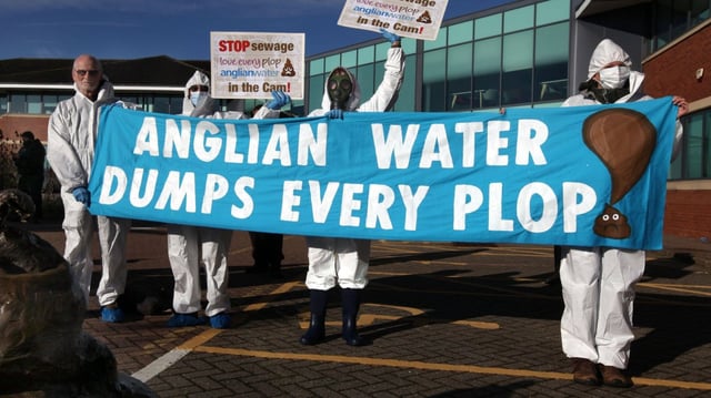 Anti-pollution protesters stage a demonstration outside Anglia Water’s offices