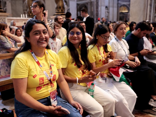 People sit inside the St. Peter's Basilica, on the day of a special Jubilee Mass for digital missionaries and Catholic influencers during Jubilee of Youth, at the Vatican, July 29, 2025. REUTERS/Remo Casilli