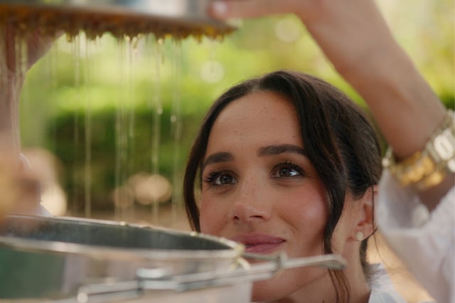 Meghan Markle collects honey from her beehives during filming for her Netflix show &#39;With Love, Meghan&#39; which broadcast in March 2025.