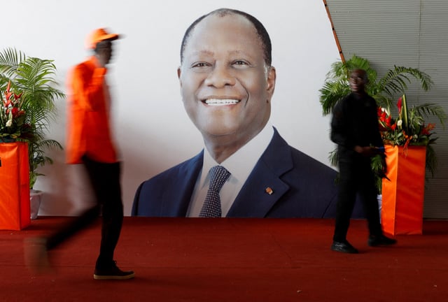 Supporters of Ivory Coast ruling party RHDP move next to the portrait of Ivory Coast President Alassane Ouattara, during the opening ceremony of their congress ahead of the October presidential election, in Abidjan, Ivory Coast June 21, 2025. REUTERS/Luc Gnago/File Photo