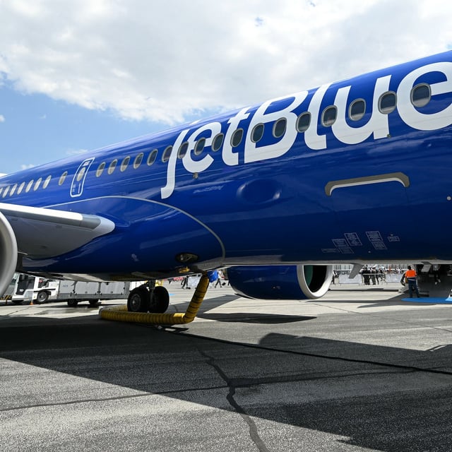 This photograph shows a Jetblue - AIRBUS A220-300 aircraft displayed during the 55th edition of the International Paris Air Show at the ParisLe Bourget Airport, in Le Bourget, suburb of Paris on June 17, 2025. (Photo by Bertrand GUAY / AFP) (Photo by BERTRAND GUAY/AFP via Getty Images)