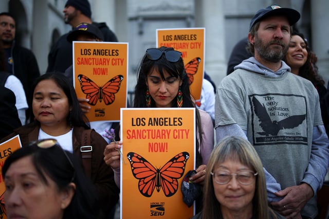 Protesters attend a pro-immigration rally as the Los Angeles City Council meets to consider adopting a "Sanctuary City'' ordinance at City Hall in Los Angeles, California, U.S. REUTERS/Daniel Cole