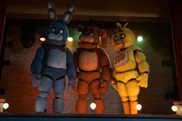 From left, Bonnie, Freddy Fazbear and Chica in “Five Nights at Freddy’s.” (Patti Perret/Universal Pictures/TNS)