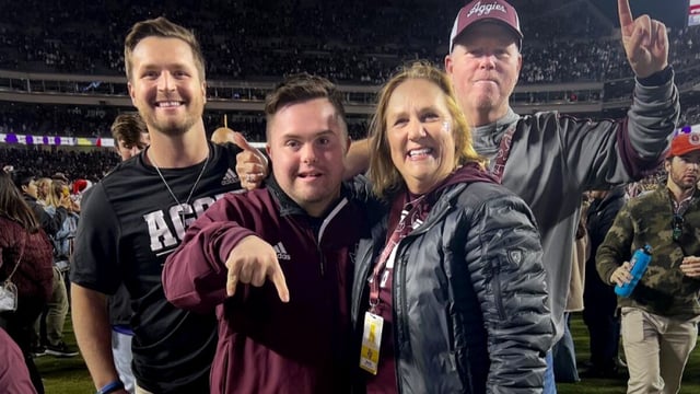 Caden Cox, second left, poses for a photo with his brother Zane, left, his mother, Mari, second right, and his father Kevin Cox, at a Texas A&M game in fall 2022. It was taken by a passerby. Zane Cox is is a strength coach at Texas A&M.