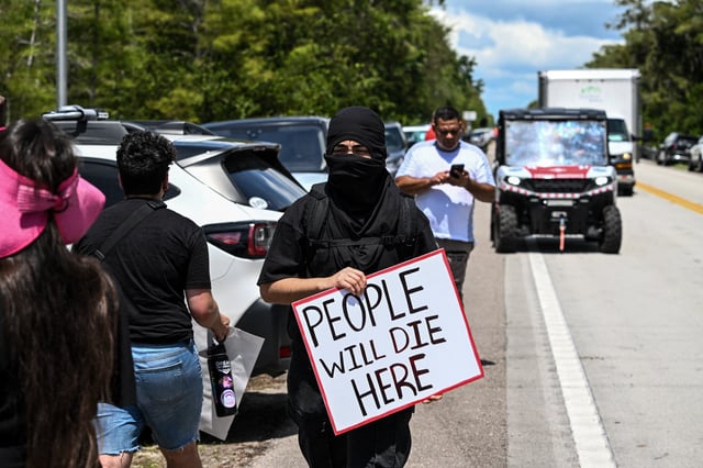 Protesters gather to demand the closure of the immigrant detention center known as &#34;Alligator Alcatraz&#34; at the Dade-Collier Training and Transition Airport in Ochopee, Florida, on July 22, 2025.