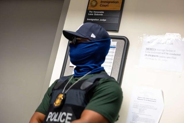 Federal agents patrol the halls of immigration court at the Jacob K. Javitz Federal Building on July 28, 2025, in New York City.