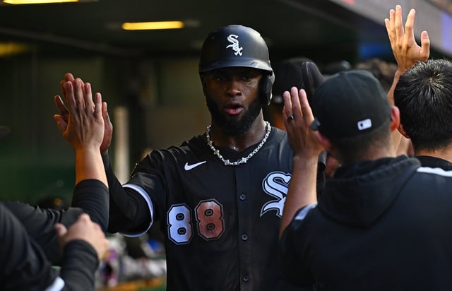 PITTSBURGH, PENNSYLVANIA - JULY 19: Luis Robert Jr. #88 of the Chicago White Sox celebrates with teammates in the dugout after coming around to score on a three run RBI double by Mike Tauchman #18 (not pictured) in the sixth inning during the game against the Pittsburgh Pirates at PNC Park on July 19, 2025 in Pittsburgh, Pennsylvania.