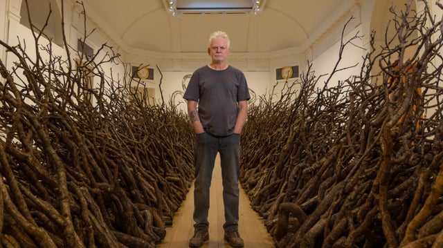 Andy Goldsworthy with his work Oak Passage, 2025
