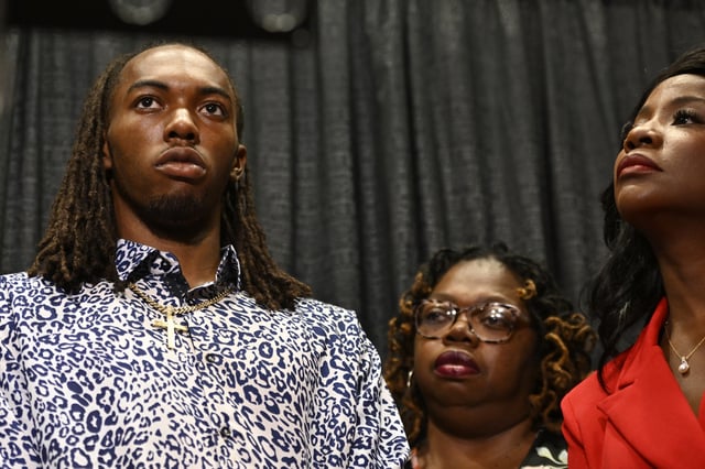 William McNeil Jr., left, along with his mother Latoya Solomon, center, and attorney Sue-Ann Robinson, right, look on during a press conference Tuesday, July 29, 2025, in Chicago. (AP Photo/Paul Beaty)