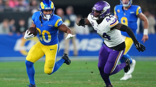 Jan 13, 2025; Glendale, AZ, USA; Los Angeles Rams running back Ronnie Rivers (20) rushes the ball against Minnesota Vikings safety Josh Metellus (44) during the second half in an NFC wild card game at State Farm Stadium. Mandatory Credit: Joe Camporeale-Imagn Images