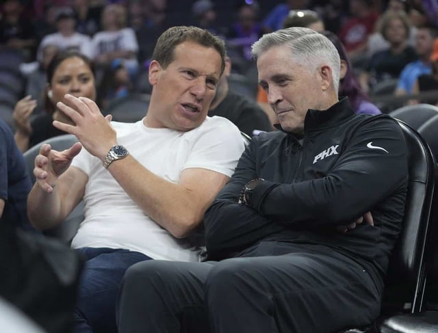 Phoenix Mercury and Suns owner Mat Ishbia (left) talks with new Suns general manager Brian Gregory during the second quarter between the Phoenix Mercury and the Minnesota Lynx at PHX Arena on July 9, 2025.