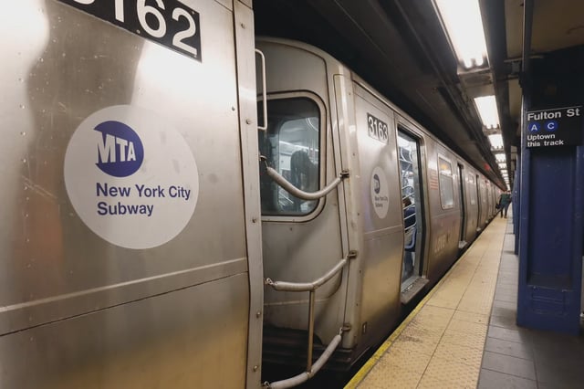 A subway train waits to depart the Fulton Street Station in 2021.