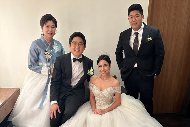 Tae Heung “Will” Kim, right, is seen here at his brother&#39;s recent wedding in South Korea. Earlier this month he was detained and held at San Francisco International Airport.