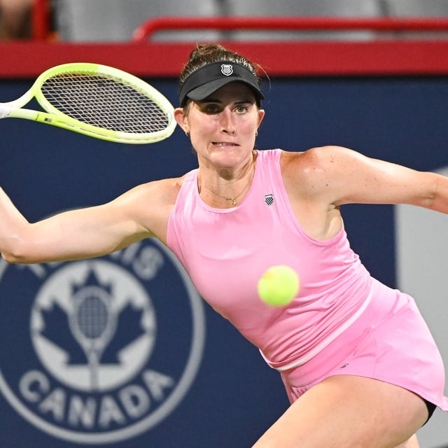 Rebecca Marino, of Canada, keeps her eyes on the ball  during her first round match against Elsa Jacquemot, of France, at the National Bank Open tennis tournament in Montreal, Sunday, July 27, 2025. THE CANADIAN PRESS/Graham Hughes