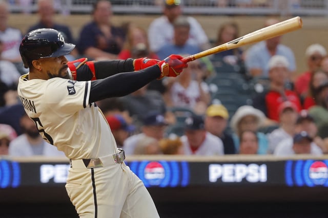 Jul 25, 2025; Minneapolis, Minnesota, USA; Minnesota Twins center fielder Byron Buxton (25) hits a sacrifice fly against the Washington Nationals in the fifth inning at Target Field. Mandatory Credit: Bruce Kluckhohn-Imagn Images/File Photo