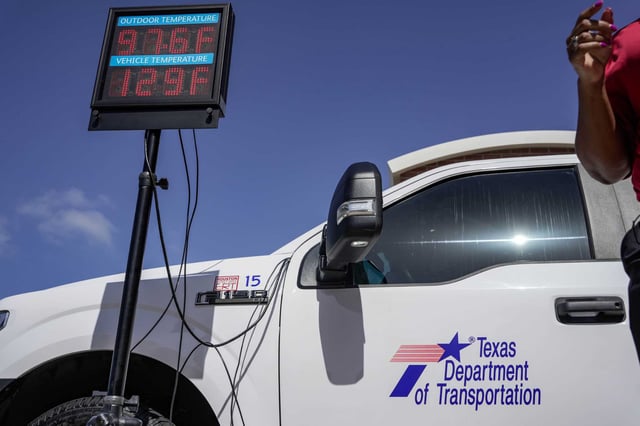 Kristen Beckworth, injury prevention manager for Texas Children’s Hospital, demonstrates the temperature difference inside and outside of a vehicle at Houston TranStar during a press conference and demonstration about vehicles getting too hot for a person to withstand inside during the heat, on Tuesday, July 29, 2025 in Houston.