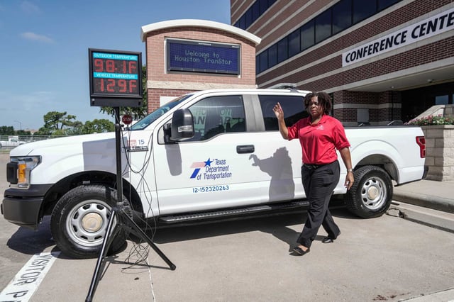 Kristen Beckworth, injury prevention manager for Texas Children’s Hospital, demonstrates the temperature difference inside and outside of a vehicle at Houston TranStar during a press conference and demonstration about vehicles getting too hot for a person to withstand inside during the heat, on Tuesday, July 29, 2025 in Houston.