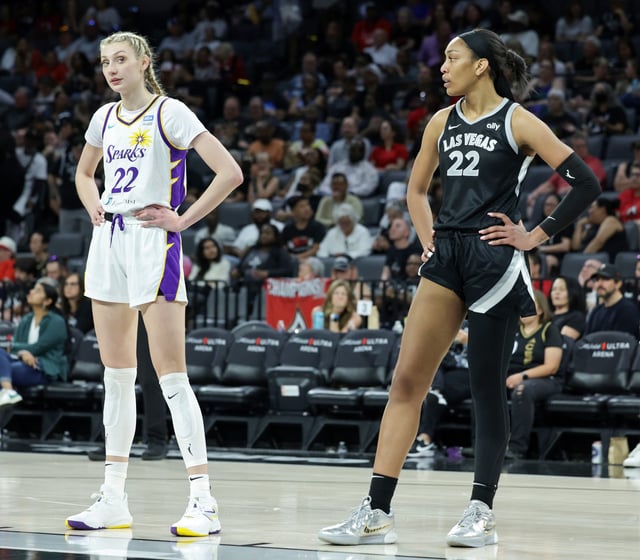 Cameron Brink #22 of the Los Angeles Sparks and A&#39;ja Wilson #22 of the Las Vegas Aces wait for a Sparks player to shoot a free throw in the third quarter of their game at Michelob ULTRA Arena on May 18, 2024 in Las Vegas, Nevada. The Aces defeated the Sparks 89-82.