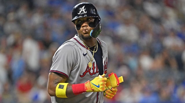 Jul 28, 2025; Kansas City, Missouri, USA; Atlanta Braves right fielder Ronald Acuna Jr. (13) looks toward the Kansas City Royals dugout after getting walked in the ninth inning at Kauffman Stadium. Mandatory Credit: Peter Aiken-Imagn Images