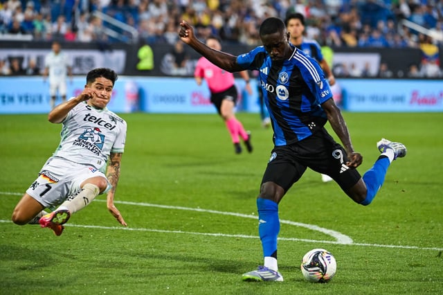 Jul 29, 2025; Montreal, Quebec, CAN; CF Montreal forward Prince Owusu (9) shoots the ball for a goal beside Club Leon defender Ivan Moreno (7) during the second half at Stade Saputo. Mandatory Credit: David Kirouac-Imagn Images