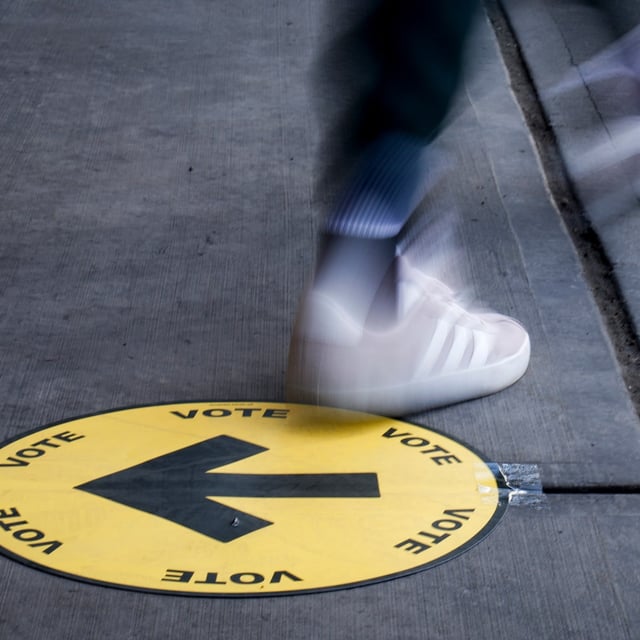 A voter leaves a polling station after casting a ballot in the federal election in Calgary on Monday, April 28, 2025. THE CANADIAN PRESS/Jeff McIntosh