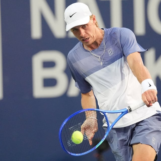 Denis Shapovalov  hits a ball to Learner Tien (not pictured) during the second round of the National Bank Open at Sobeys Stadium in Toronto.
