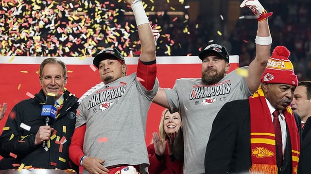 Jan 26, 2025; Kansas City, MO, USA; Kansas City Chiefs quarterback Patrick Mahomes (15) and tight end Travis Kelce (87) react after holding the Lamar Hunt Trophy after the AFC Championship game against the Buffalo Bills at GEHA Field at Arrowhead Stadium. Mandatory Credit: Denny Medley-Imagn Images
