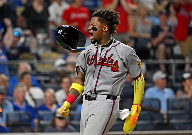 Jul 28, 2025; Kansas City, Missouri, USA;  Atlanta Braves right fielder Ronald Acuna Jr. (13) losses his helmet after scoring a run in the eighth inning against the Kansas City Royals at Kauffman Stadium. Mandatory Credit: Peter Aiken-Imagn Images/File Photo